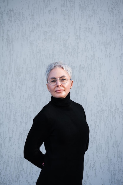 Portrait of beautiful senior woman with white hair and eyewear outdoor