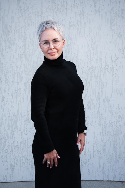 Portrait of beautiful senior woman with white hair and eyewear outdoor