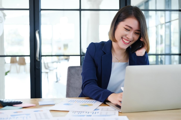 Portrait of beautiful and smart young entrepreneur businesswoman working in modern work station