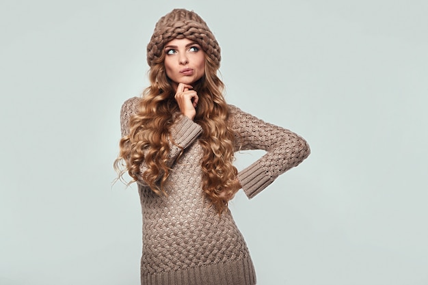 Portrait of beautiful smiling blond woman in sweater