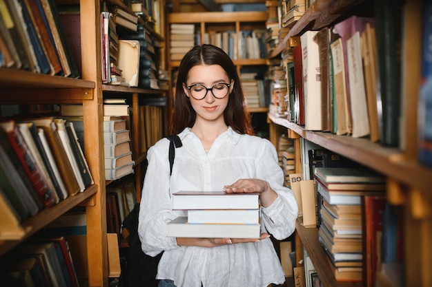 Portrait of a beautiful student in a library