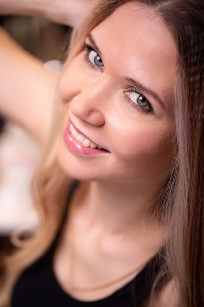 Portrait of a beautiful stylish with blond hair fashionable makeup Closeup focus on the eyes