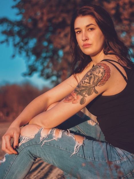 Portrait of a beautiful tattooed brunette