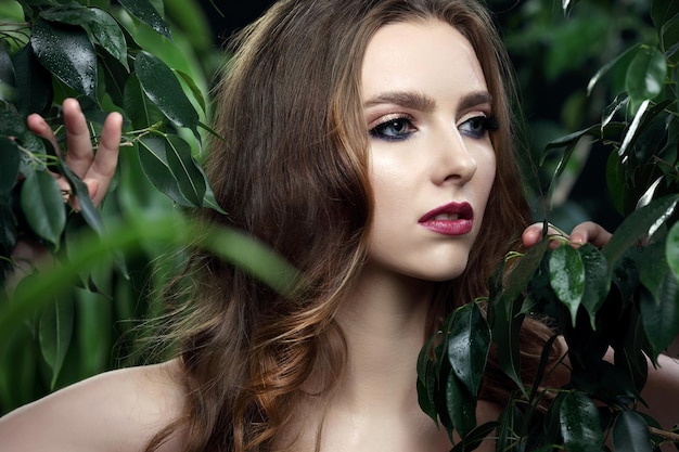 Portrait of a beautiful teen girl with long curly hairs and clean skin of the face