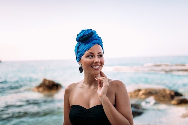 Portrait of a beautiful woman by the sea.