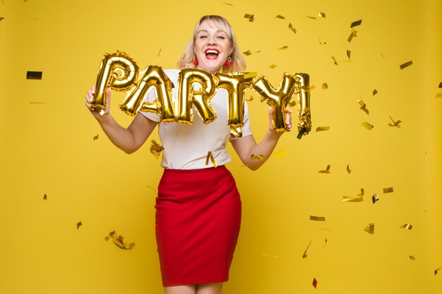 Portrait of beautiful woman celebrating a party and having fun