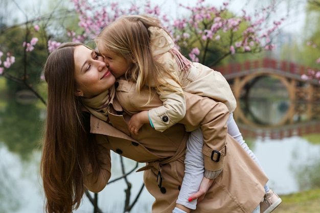 Portrait of beautiful woman and girl outdoor