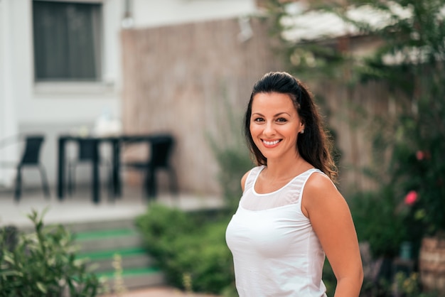 Portrait of a beautiful woman in the gome garden.