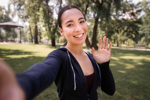 Portrait of beautiful woman taking a selfie