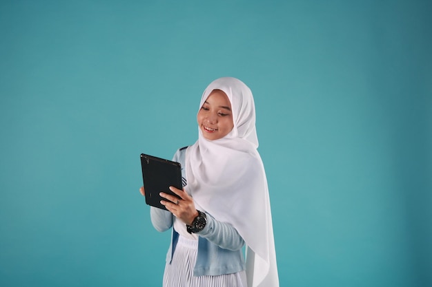 Portrait of a beautiful woman using tablet computer