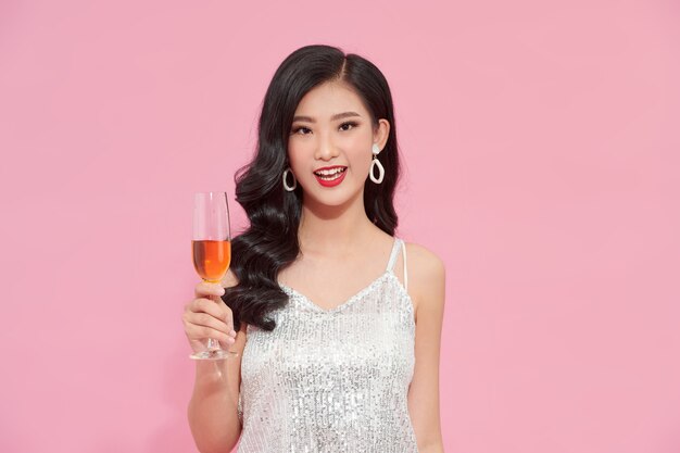 Portrait beautiful woman wearing stylish outfit with a wine glass