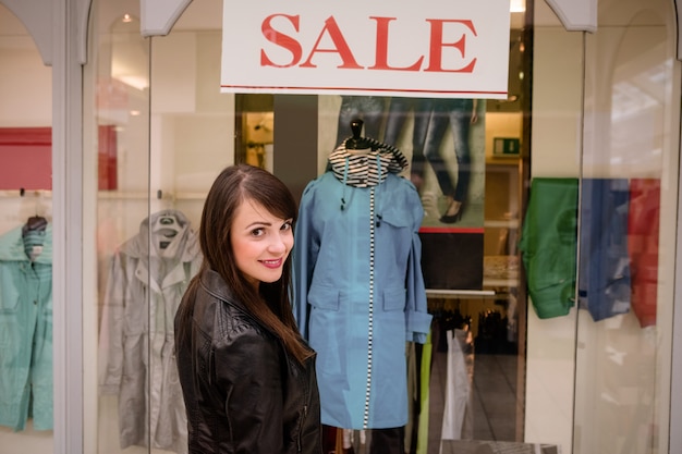 Portrait of beautiful woman window shopping