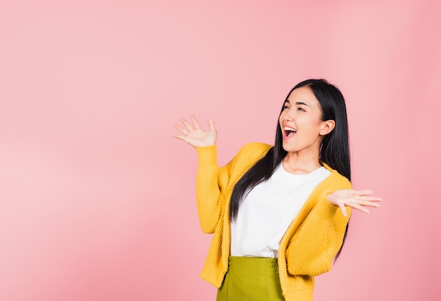 portrait beautiful woman winning and surprised excited screaming open mouth raise hands