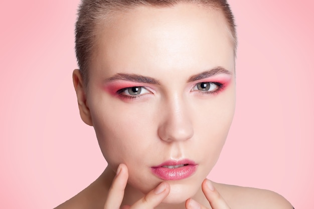 Portrait of beautiful woman with colourful makeup