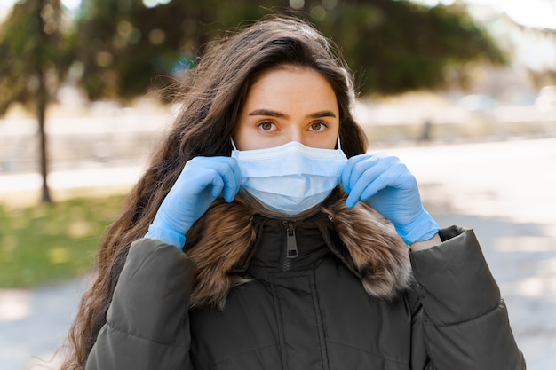 Portrait of beautiful women in medical mask and gloves