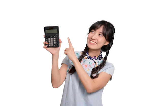 Portrait of beautiful young asian woman in denim dress holding calculator on white background business shopping online concept