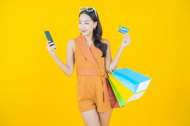 Portrait of beautiful  young asian woman smile with shopping bag  