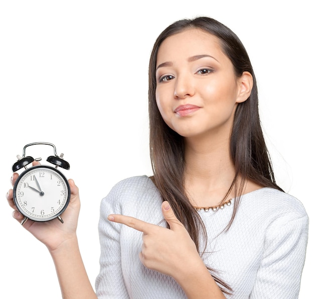 Portrait of beautiful young business woman holding in hands clock