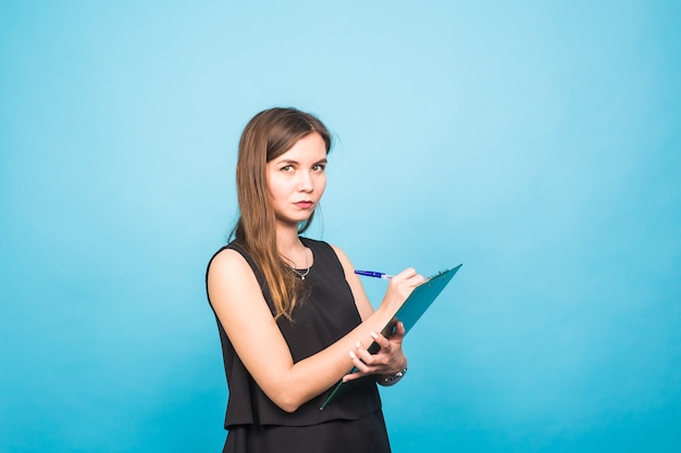 Portrait of beautiful and young business woman working at the desk.