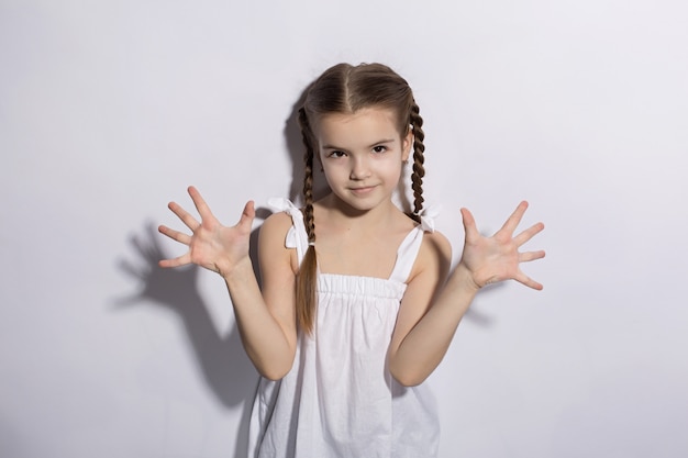 Portrait of a beautiful young caucasian woman in a light dress