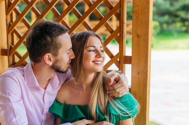 Portrait of beautiful young couple in love in the park