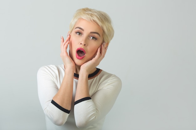 portrait of beautiful young female with short haircut and makeup