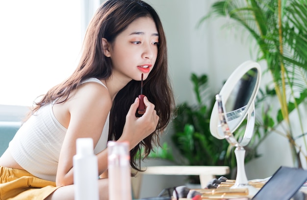 Portrait of beautiful young girl with makeup in the morning