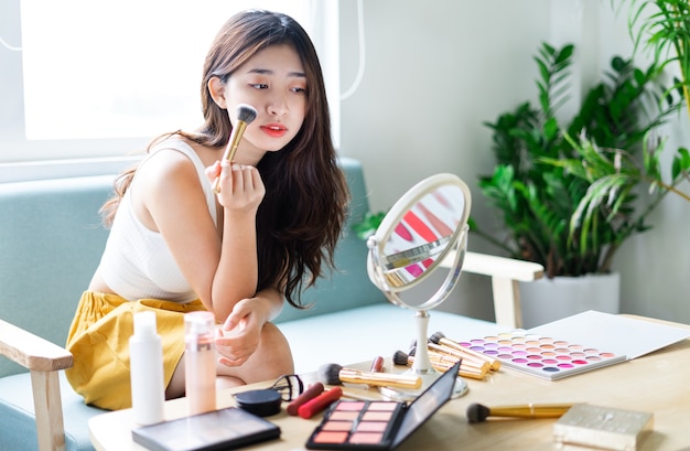 Portrait of beautiful young girl with makeup in the morning