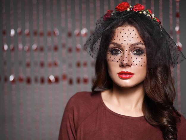 Portrait of beautiful young woman face Isolated on dark background