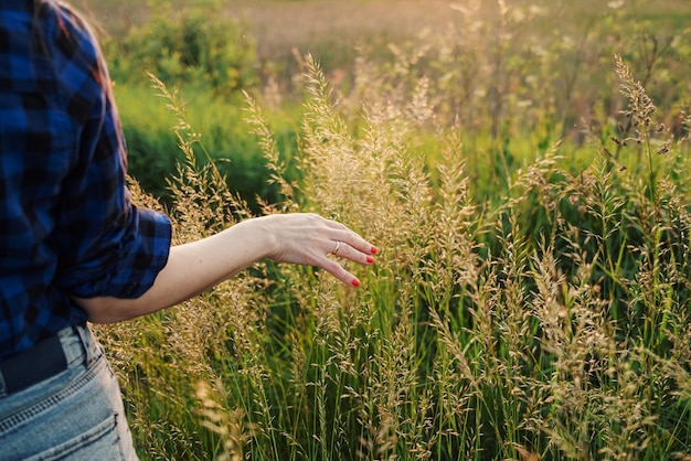 Portrait of a beautiful young woman on meadow