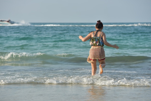 Portrait of a beautiful young woman at the sea.