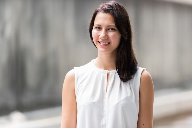 Portrait Of Beautiful Young Woman Smiling Outdoors