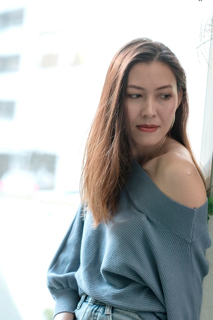 Portrait of beautiful young woman standing outdoors