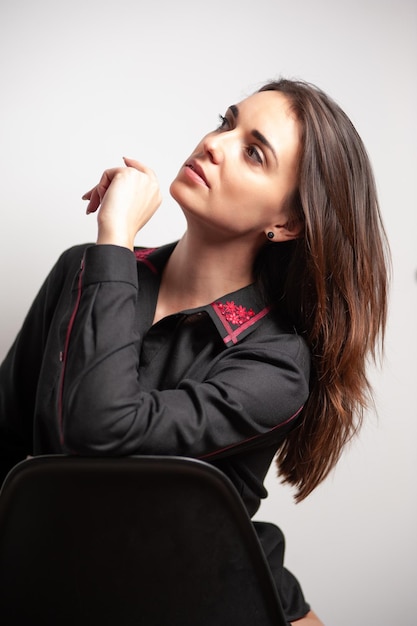 portrait of a beautiful young woman wearing fashion clothing. studio shot on white background.