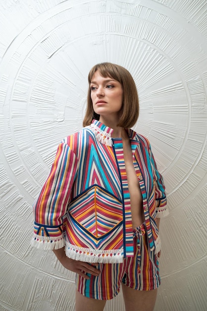 portrait of a beautiful young woman wearing fashion clothing. studio shot on white background.