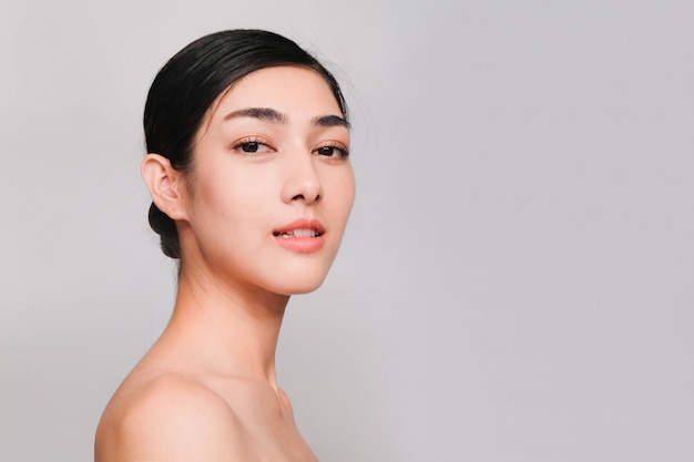 Portrait of a beautiful young woman over white background