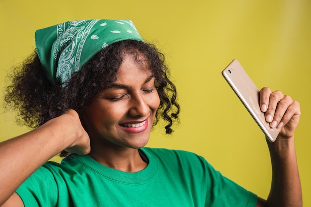 Portrait of a beautiful young woman with closed eyes and afro dance style