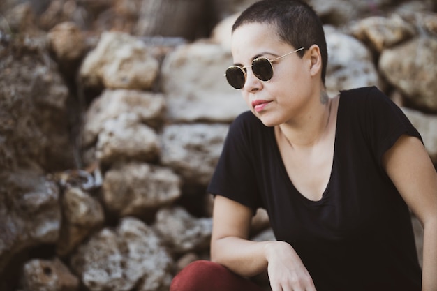 Portrait of a beautiful young woman with shaved head