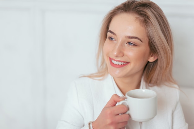 Portrait of beautiful young woman working in the office.