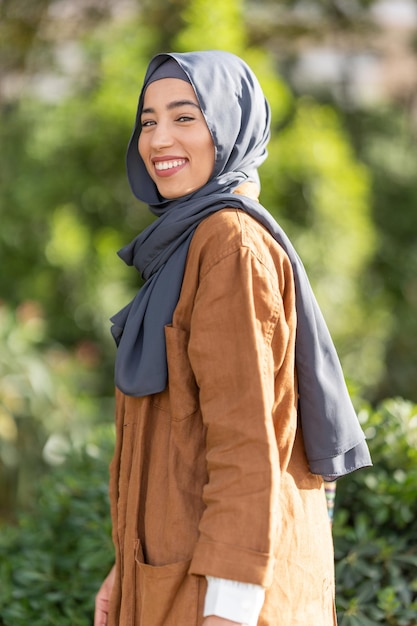 Portrait of beauty muslim woman smiling to the camera outdoors