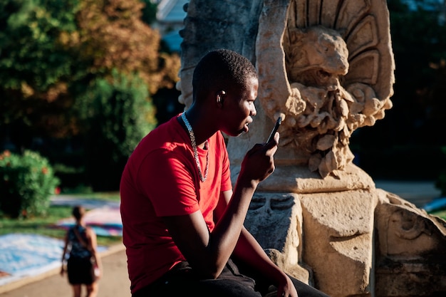 Portrait of a black boy in the city - concept portrait