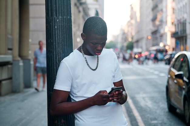 Portrait of a black boy in the city - concept portrait