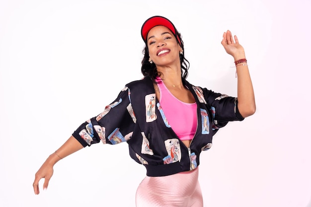 Portrait of black ethnic woman dancing on a white background samba cuban traditional dance urban outfit