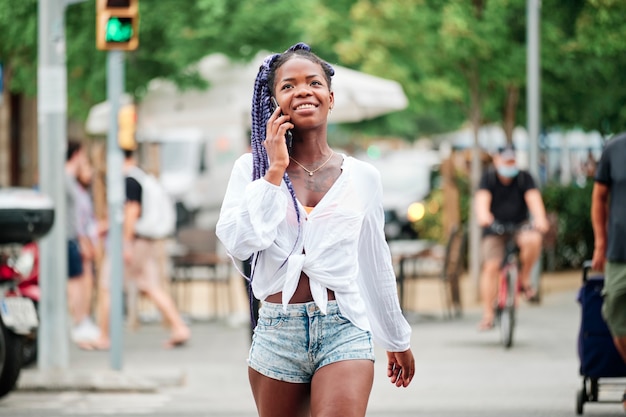 Portrait of a black girl walking in the city