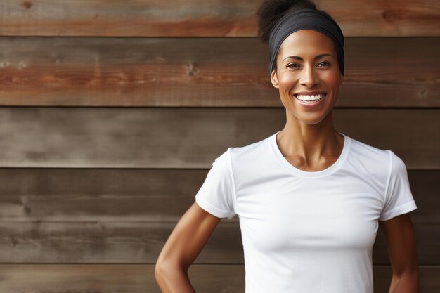 Portrait of a black smiling woman in a white clear tshirt mockup on an wooden background