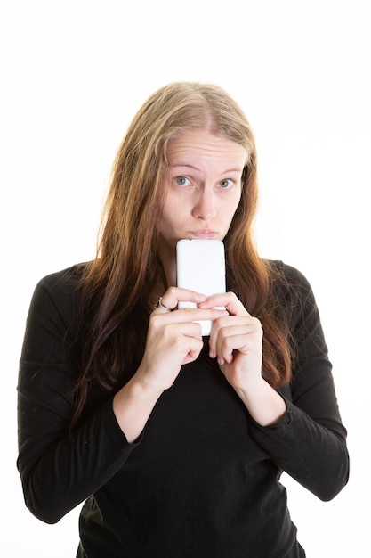 Portrait blonde woman mobile phone on chin being in doubt and thinking stressed