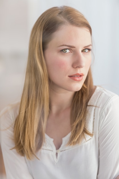 Portrait of a blonde woman posing looking at camera