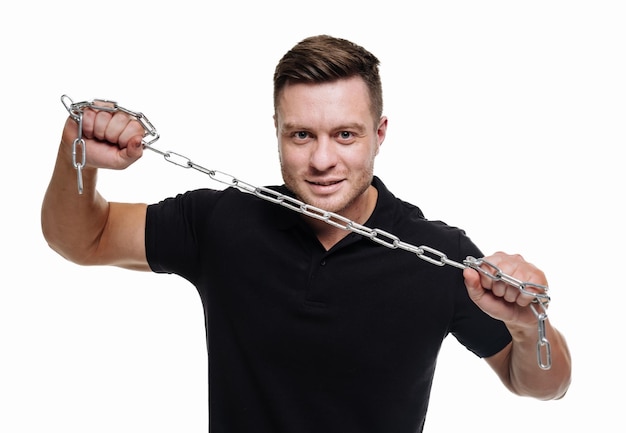 Portrait of a bodybuilder with chain The Perfect male body Awesome bodybuilder posing Isolated on white background