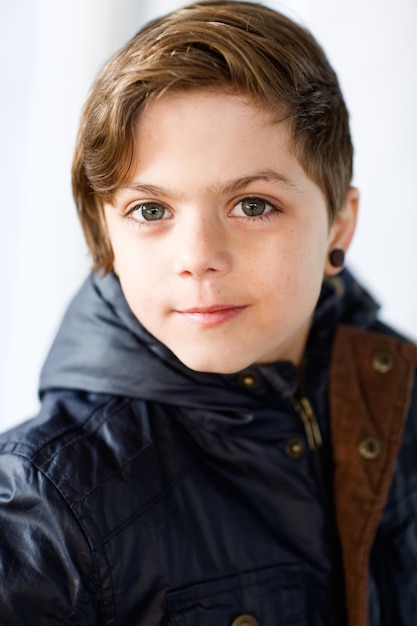 Portrait of boy in blue parka