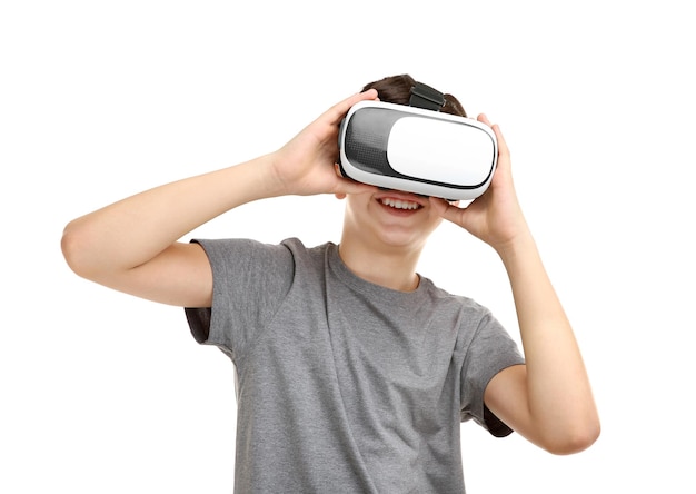 Portrait of boy having fun with virtual reality headset on white background